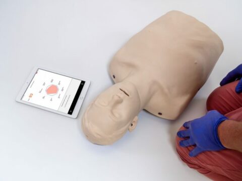 Brayden-Pro-with-tablet-showing-CPR-summary-scaled-600x450